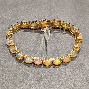 Opal tennis bracelet set in gold plated 925 sterling silver.